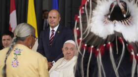 Pope Francis meets the Canadian Indigenous people as he arrives at Edmonton's International airport, Canada, on Sunday.