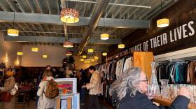 People perusing the aisles at Boomerangs by More Than Words