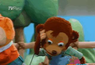 A monkey puppet makes a shocked face.