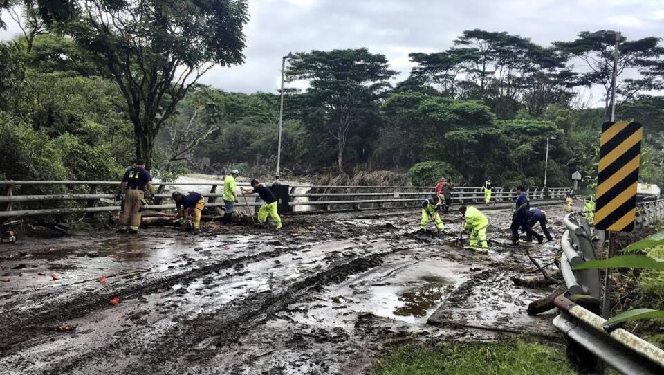 Crews on Friday worked at clearing damage from Hurricane Lane near Hilo, Hawaii. The hurricane dumped torrential rains which inundated the Big Island's main city.