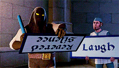 An animated man holds up a cue card that reads "Aawww"