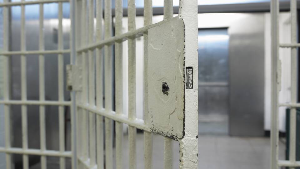 Open door to prison cell