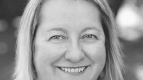 A woman mid-age smiling