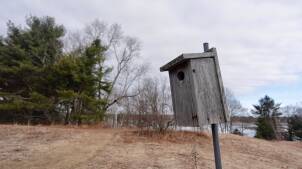 A bird house sits on a hill at the Maine Audubon Center in Falmouth, Maine on March 13, 2025.