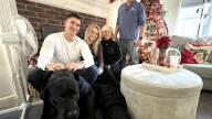 Gabriella Parker, second from left, an Orleans firefighter and paramedic, talked about the challenge of buying a house in today's Cape Cod real estate market, compared to what it was like for her firefighter father, Donald Parker, right. Seated with Parker are her boyfriend, Erik Simonsen, mother, Laurie Parker, and dogs Tuukka and Bella.