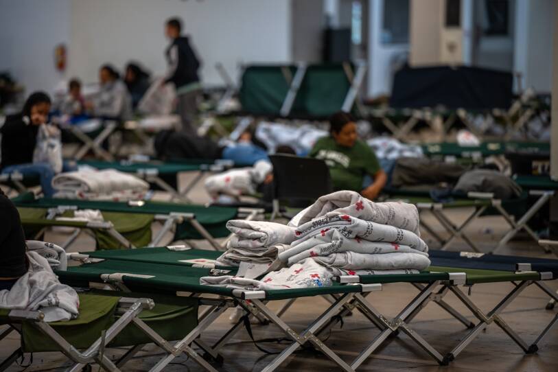 Migrants wait to be reunited with family members and sponsors at Casa Alitas in Tucson, Arizona on Friday, March 29, 2024.