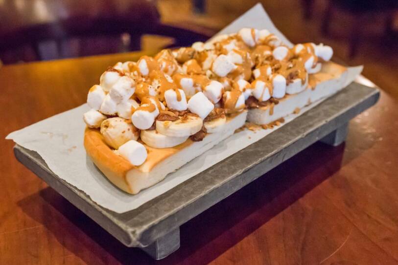 Half of a chocolate chunks pizza at Max Brenner in Boston with "the works".