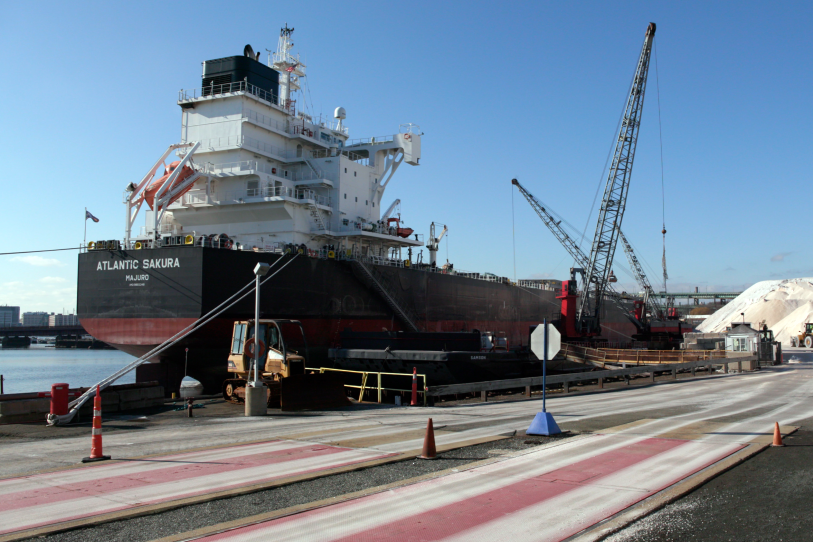 A large cargo ship is at berth.