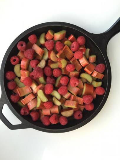 Rhubarb and rasberries in a pan.