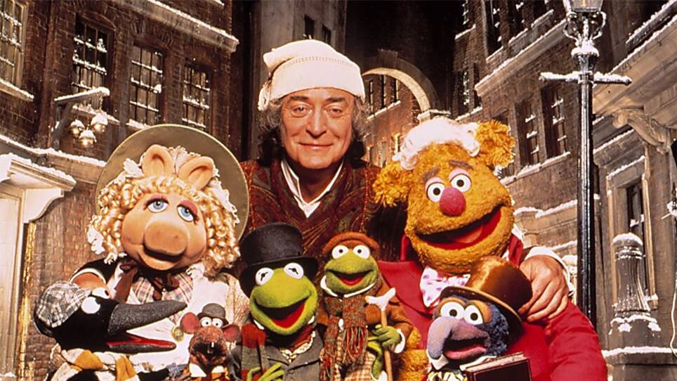 Michael Caine as Ebenezer Scrooge with his fellow cast members of A Muppet Christmas Carol (1992)