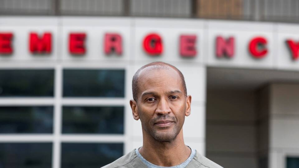 Dr. William Strudwick stands outside Howard University Hospital, where he works as an attending physician in the emergency department.