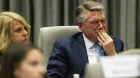 Mark Harris, Republican candidate in North Carolina's 9th Congressional race, fights back tears at the conclusion of his son John Harris' testimony during the third day of a public evidentiary hearing on the 9th Congressional District voting irregularities investigation last week.