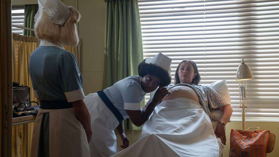 Trixie supervises Joyce as she examines expecting mother Prue