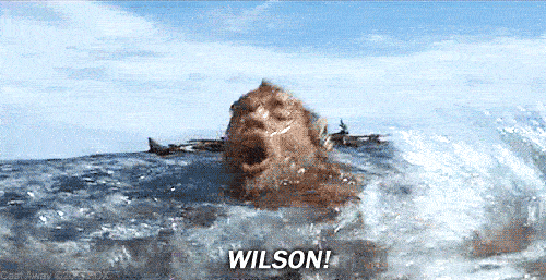 A man struggles to keep his head above water in the ocean, yelling "Wilson!"