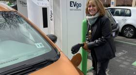 Pam Frank, CEO of ChargEVC, drives a bright Orange Chevrolet Bolt because she wants others to notice its an electric car.