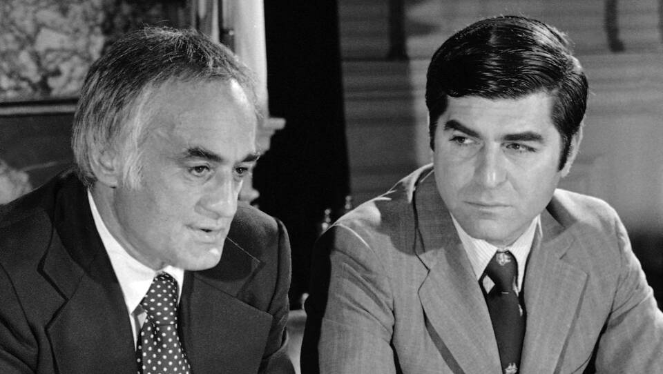 Two men in suits in this black and white photo
