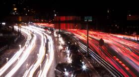 cars sitting in traffic on a highway in Boston