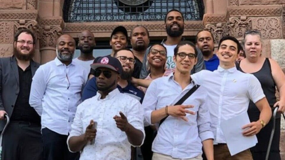 A group of people smiling at the camera.