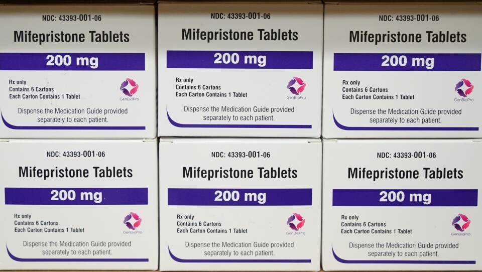 Stacks of small boxes are labeled "Mifepristone Tablets: 200mg."