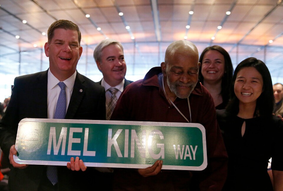 Mel King and contemporary politicians pose with a street sign: "Mel King Way."