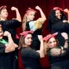 Six women wearing bandanas hold their arms up in a "Rosie the Riveter" pose.