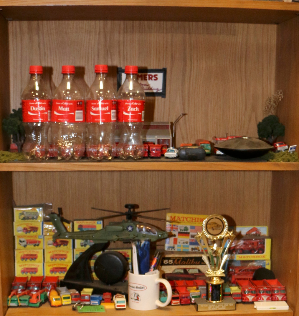 Unseen Coke bottles on shelf.png