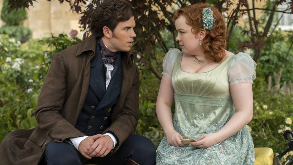 Luke Newton as Colin Bridgerton, Nicola Coughlan as Penelope Featherington in episode 301 of Bridgerton.
