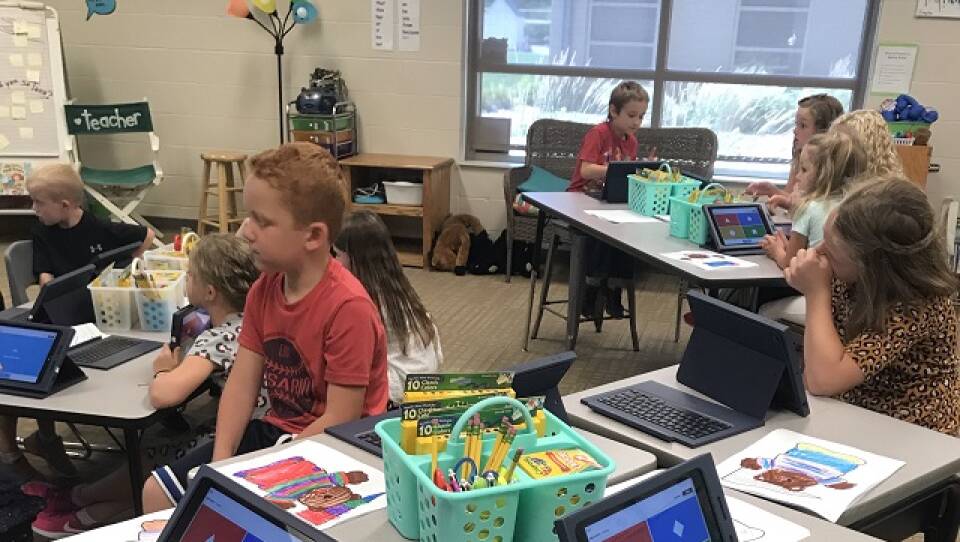 Students at Northern Cass School practice using iPads.