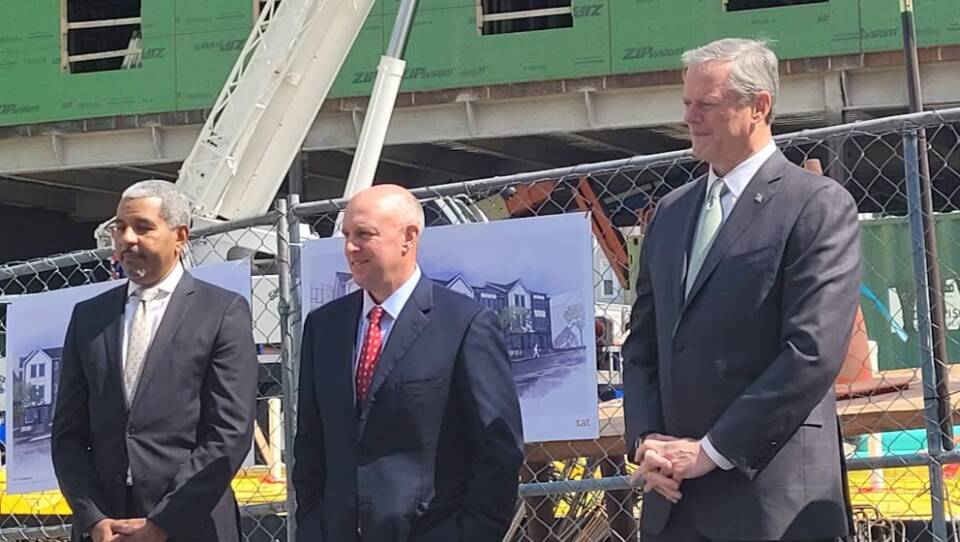 Easton Boston Neighborhood Health Center president Manny Lopes, state Housing and Economic Development Secretary Michael Kennealy and Gov. Charlie Baker at a senior housing complex in Everett.