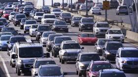 Three lanes of packed traffic across the Zakim Bridge in Boston.