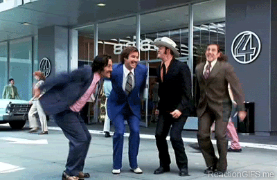 Four men jump for joy