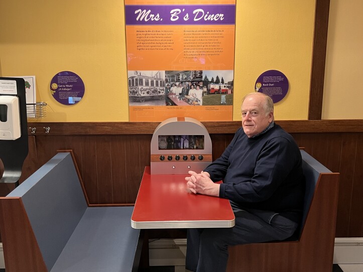 A man sits at a table.
