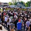 People gather outside the scene of a shooting at a supermarket in Buffalo, N.Y., Sunday, May 15, 2022.
