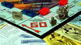A novelty version of  onopoly shows spots for "Yahoo" and a token that's a cursor.