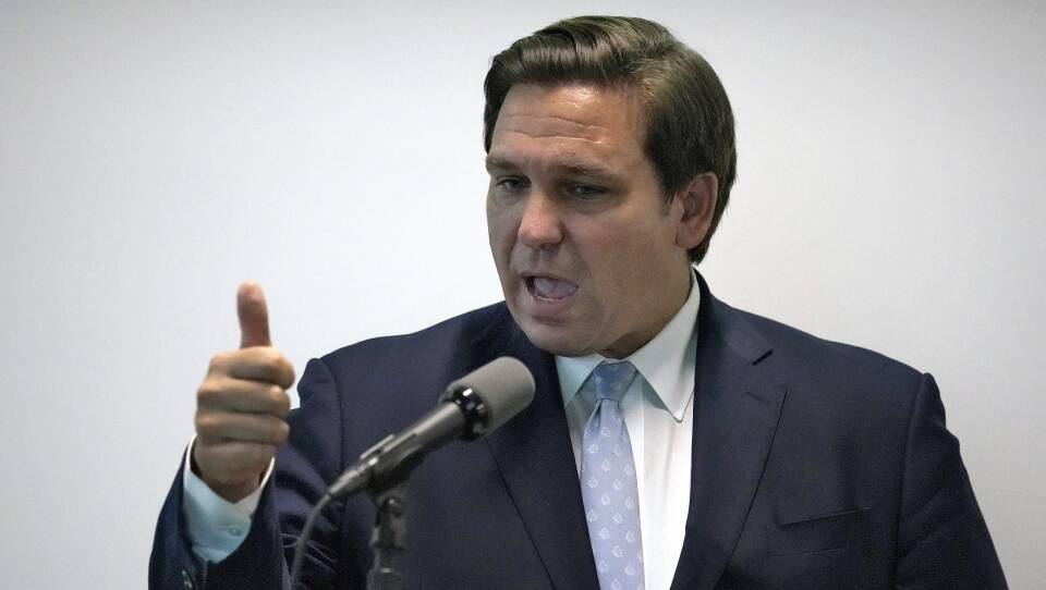 Florida Gov. Ron DeSantis, pictured during a news conference last month, says his state is ready to respond if a surge of coronavirus infections emerges.