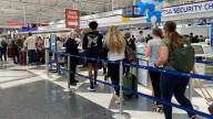 Travelers line up to get into the security checkpoint at Chicago's O'Hare airport last summer.