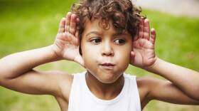 Boy (4-5) making faces