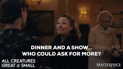 A woman says "Dinner and a show... who could ask for more?"