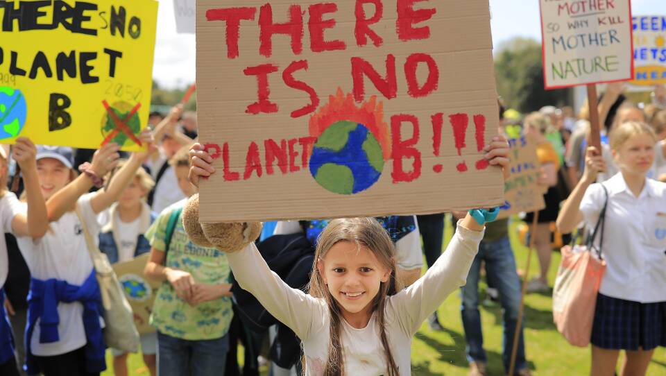 Thousands of school students join protesters in a Climate Strike rally on Friday in Sydney, Australia. Rallies held across Australia are part of a global mass day of action demanding action on the climate crisis.