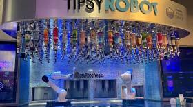 This bar inside Planet Hollywood on the Las Vegas strip has two robots that serve customers drinks. The Tipsy Robot opened a second location on the strip this year.