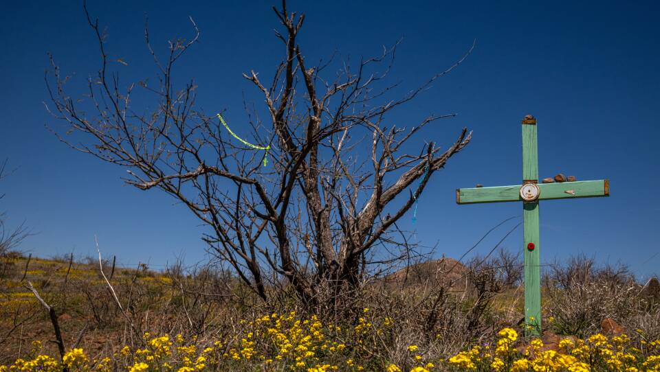Álvaro Enciso places crosses at sites where migrants are known to have died in the borderland, this cross represents the death of Nolberto Torres-Zayas just east of Arivaca, Arizona on Wednesday, March 27, 2024. Torres-Zayas died of hyperthermia in 2009, not far from a Humane Borders water cache that had been vandalized and drained.
