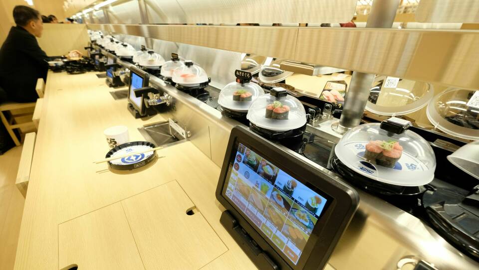 The global flagship store for Kura Sushi, a Japanese conveyor-belt sushi restaurant chain, is pictured here in January 2020 in Tokyo. Conveyor-belt sushi restaurants have been the target of a spate of pranks.