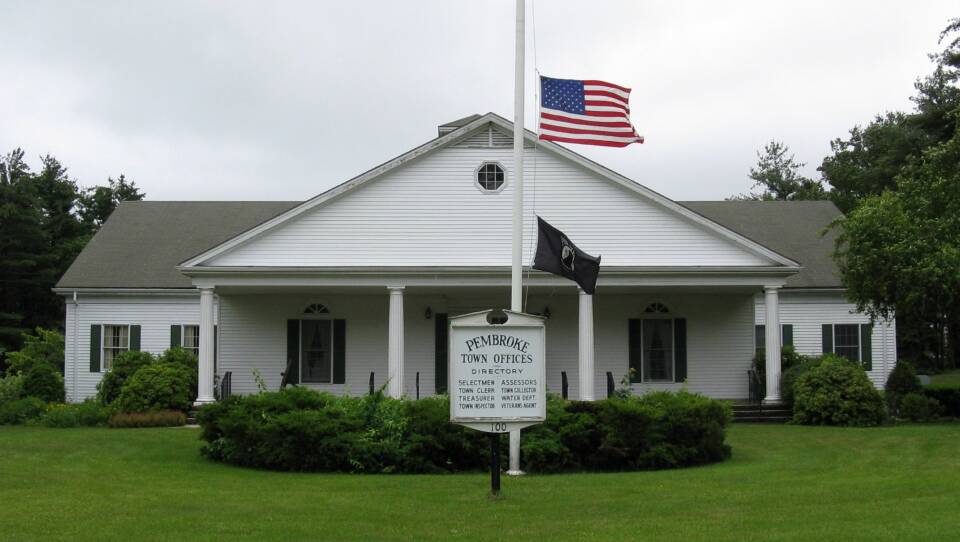 A white town office building in Pembroke, Massachusetts