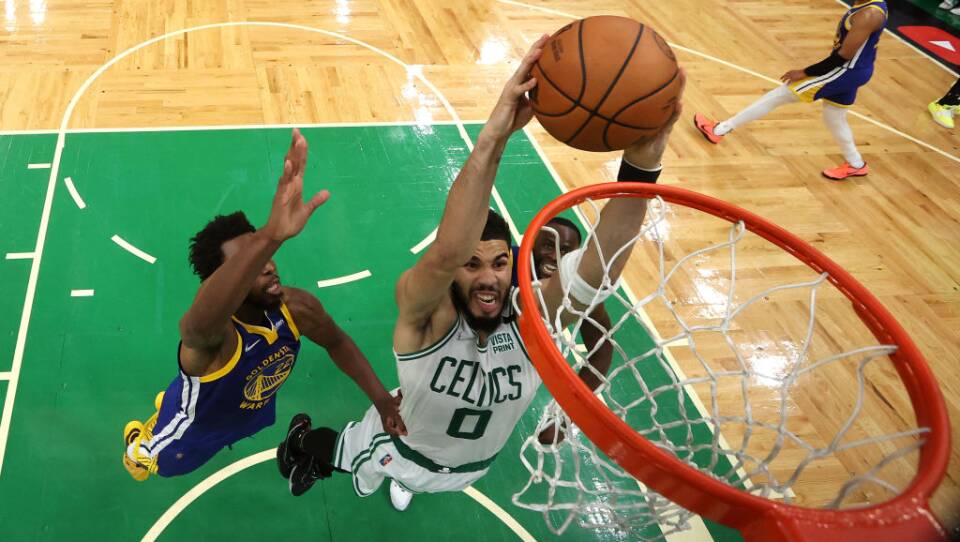 Jayson Tatum of the Boston Celtics dunks the basketball in the hoop