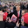 Former President Donald Trump gestures to supporters as he arrives at a campaign stop in Londonderry, Tuesday, Jan. 23, 2024.