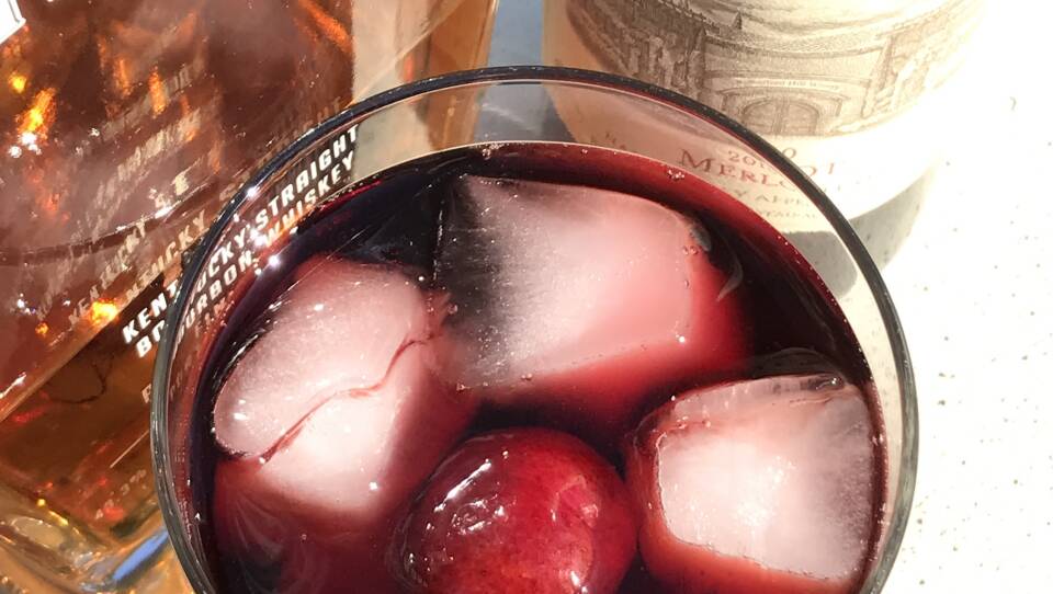 Bourbon and muddled cherries in chilled red wine.