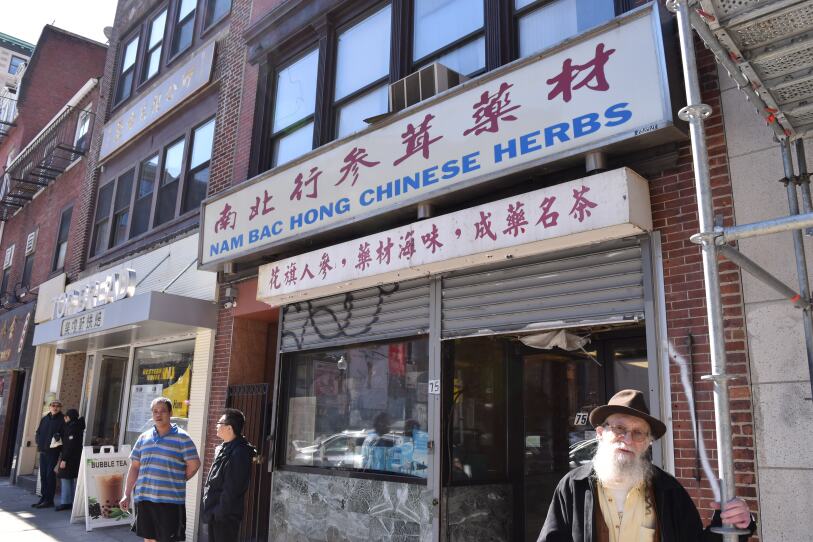 Mushroom dealer Benjamin Malleson in front of Nam Boc Hong Chinese Herbs.