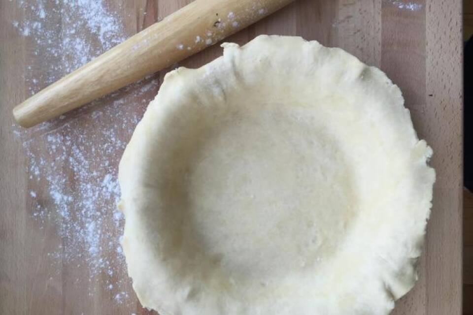 Pastry dough in pie dish.