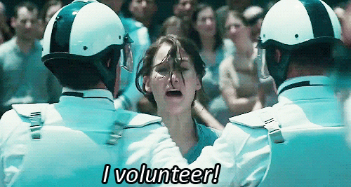 A woman screams "I volunteer!"