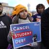 Student debt relief advocates gather outside the Supreme Court on Capitol Hill in Washington, carrying signs to cancel student loan debt.